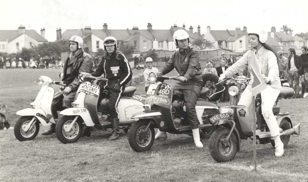 Christine Jackson in Mini TT in England with Lambretta scooters