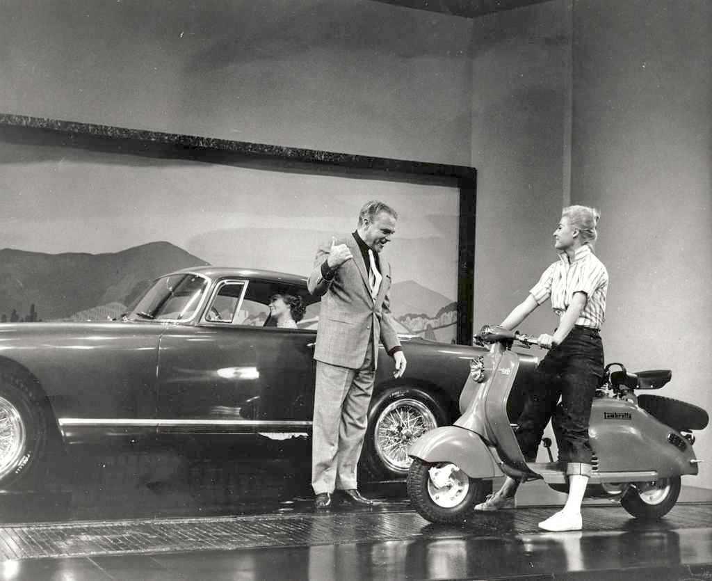 James Cagney with the Lambretta 150LD USA next to car