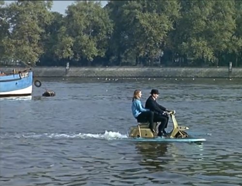Two persons on Lambretta on water